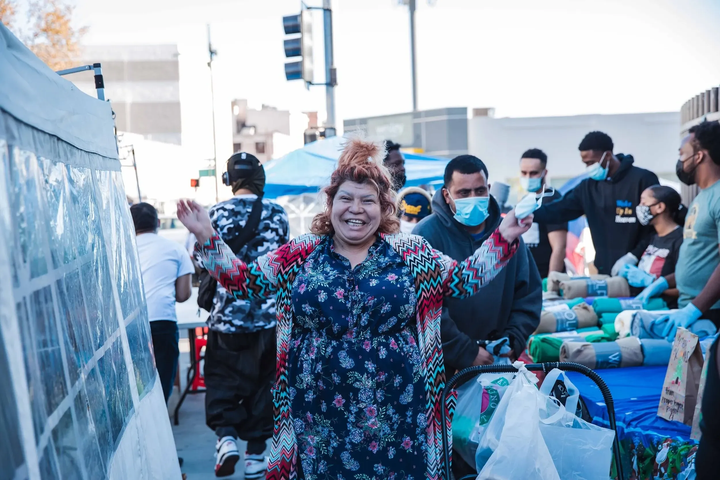 A smiling woman at a Healing Circle LA community resource giveaway in Los Angeles