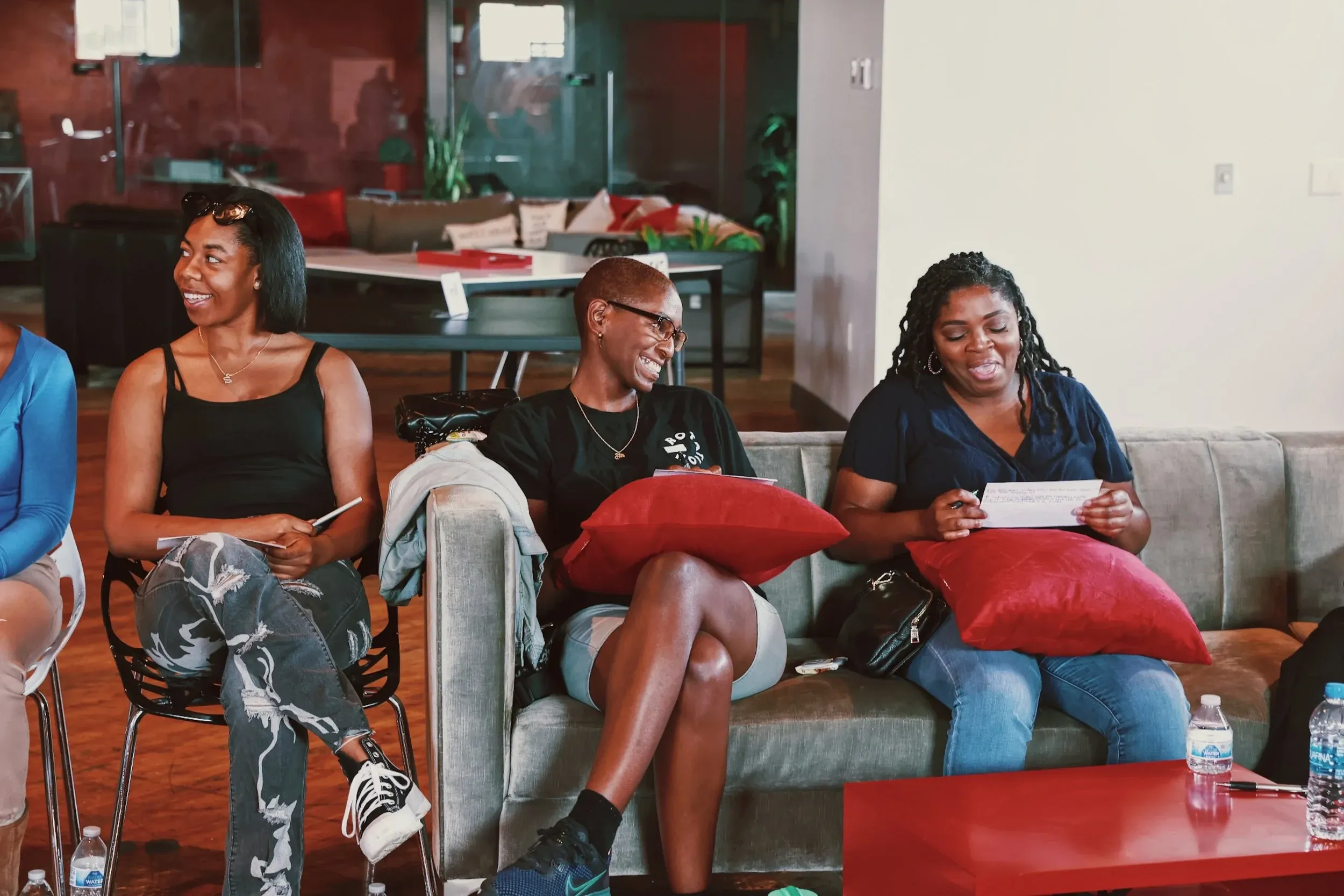 Women smiling and talking during a weekly Healing Circle LA gathering